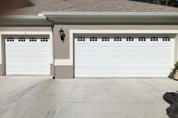 New construction home with standard garage doors and cascade glass.