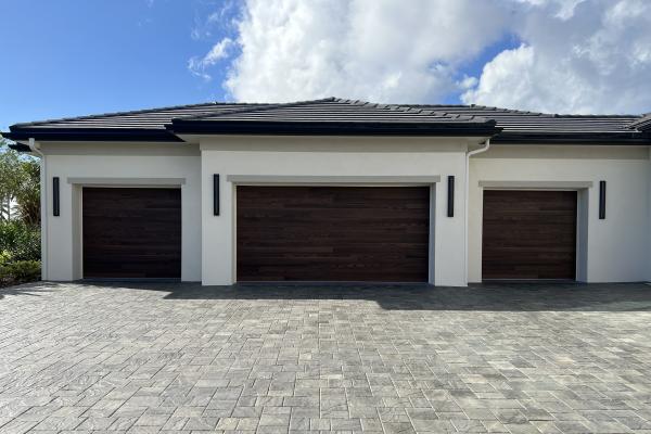 CHI Model 2717 Accents Planks Garage Doors in Dark Oak installed by ABS Garage Doors in Palm Coast, Florida