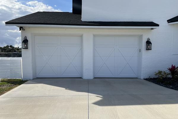 CHI model 5334 Overlay Carriage House garage doors installed by ABS Garage Doors in Flagler Beach, FL.
